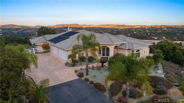 view of front of property with a garage