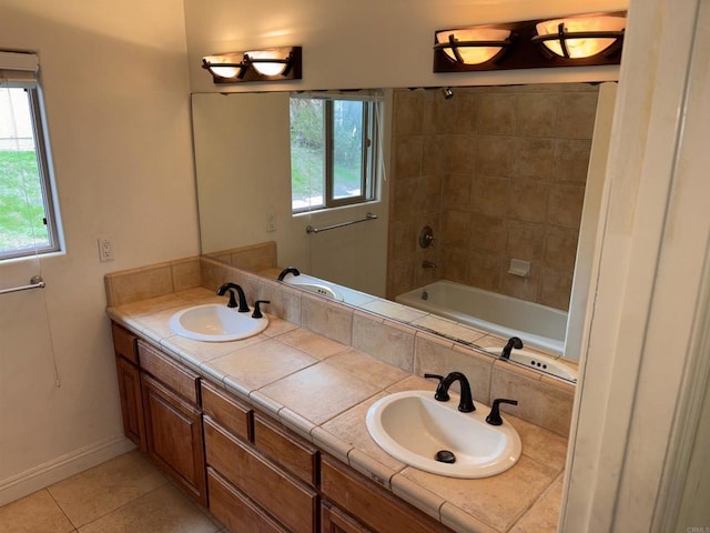 full bathroom with tile patterned flooring, a sink, baseboards, and double vanity