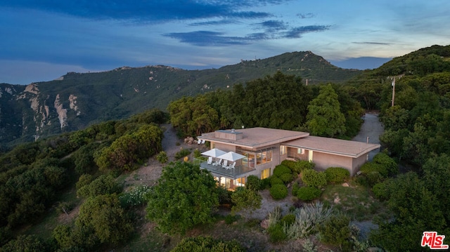 aerial view at dusk with a mountain view