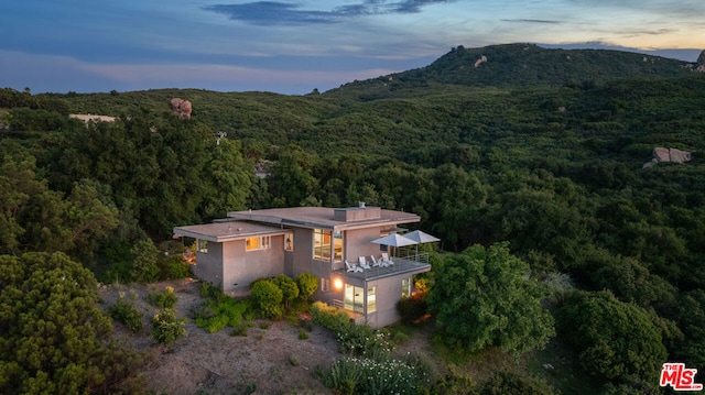 aerial view at dusk with a mountain view