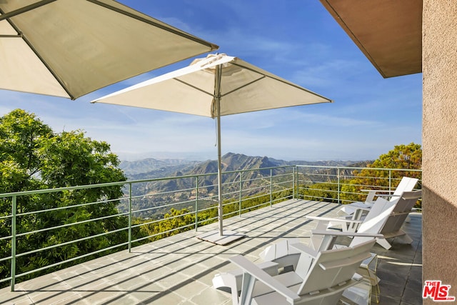 balcony featuring a mountain view