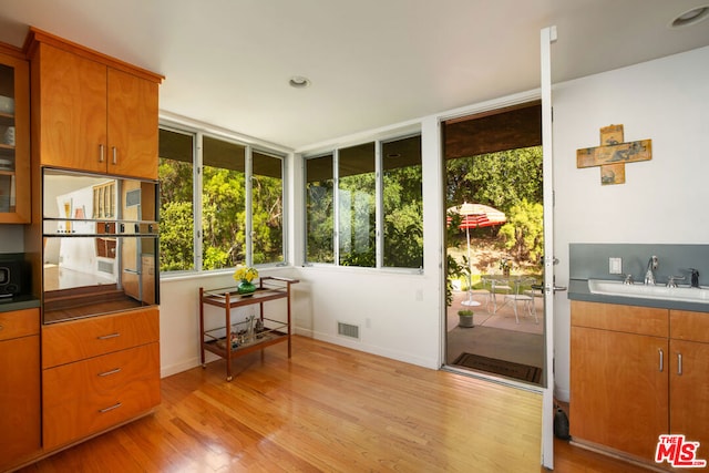 sunroom / solarium with sink