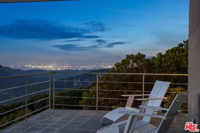 patio terrace at dusk with a balcony