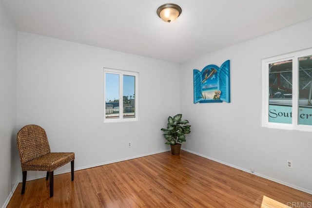 sitting room with hardwood / wood-style flooring