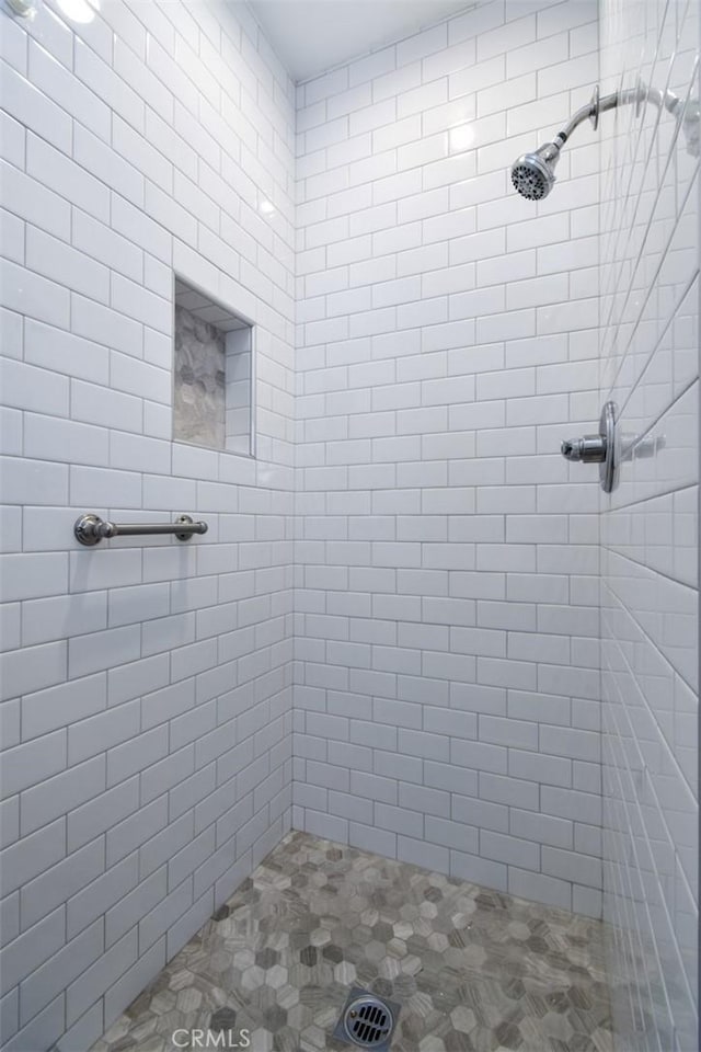 full bathroom with a tile shower