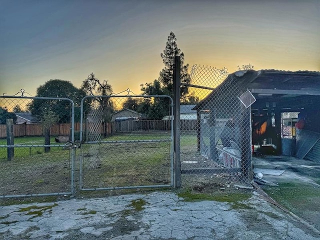 view of gate at dusk