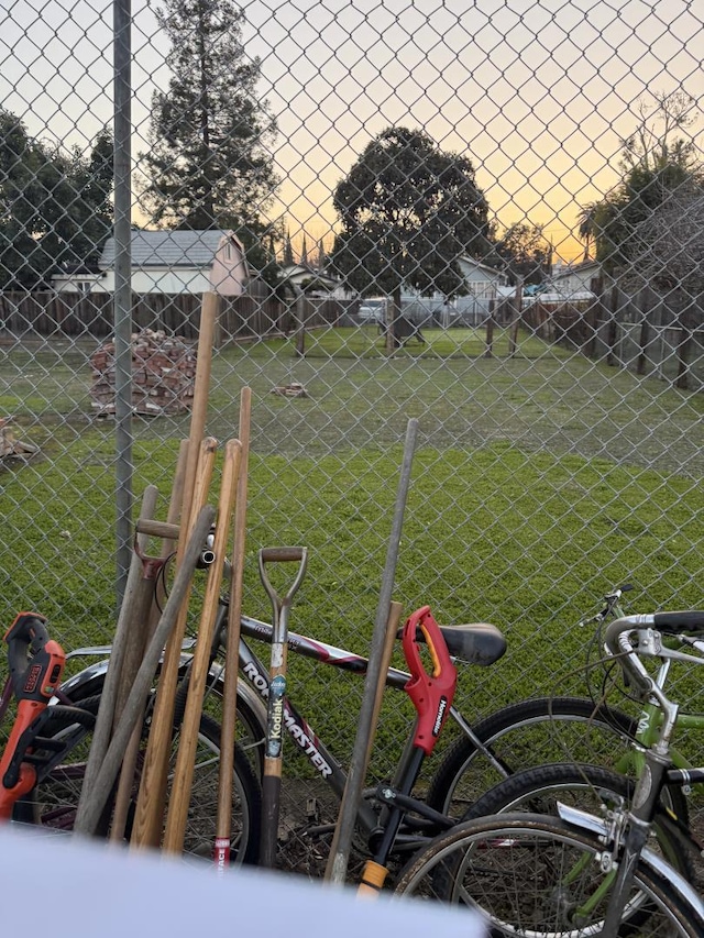 view of yard at dusk