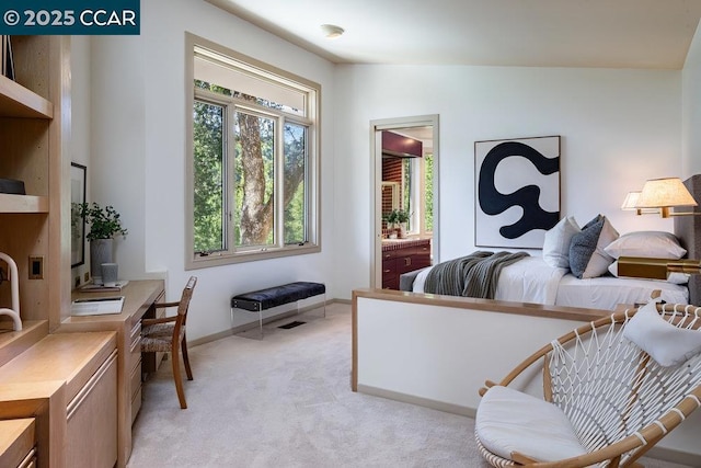 bedroom with light colored carpet