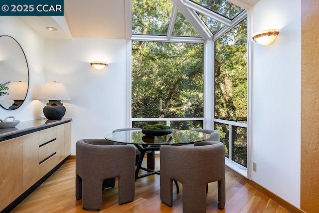 dining space featuring light wood-type flooring