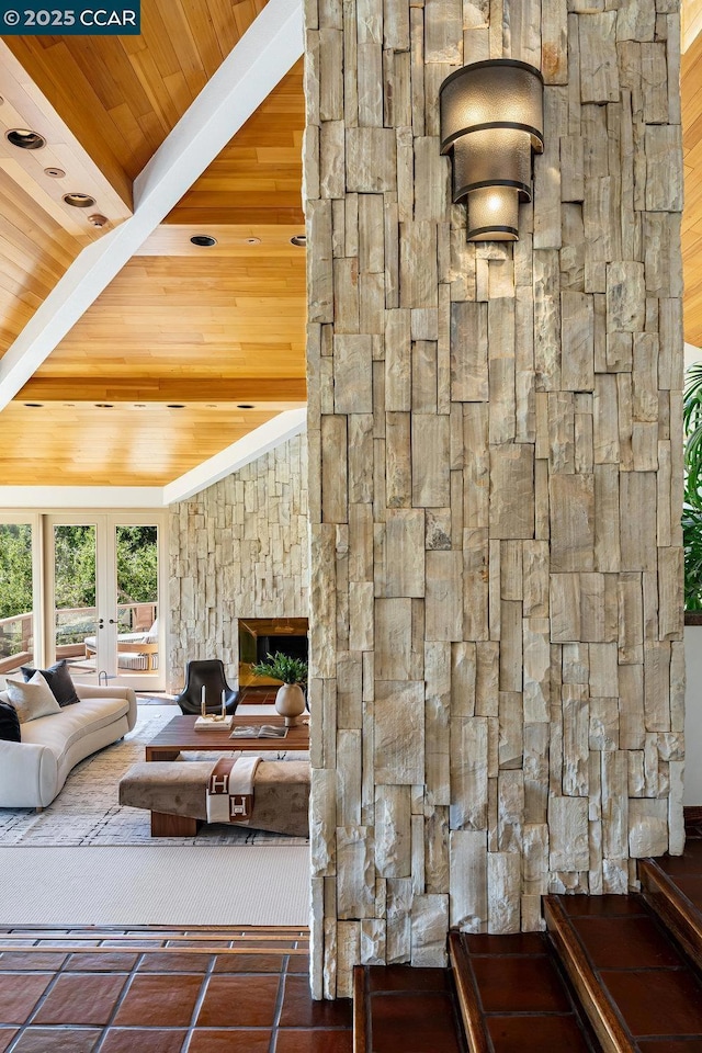 living room with wooden ceiling, vaulted ceiling, and french doors