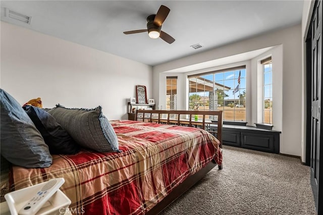 carpeted bedroom with ceiling fan