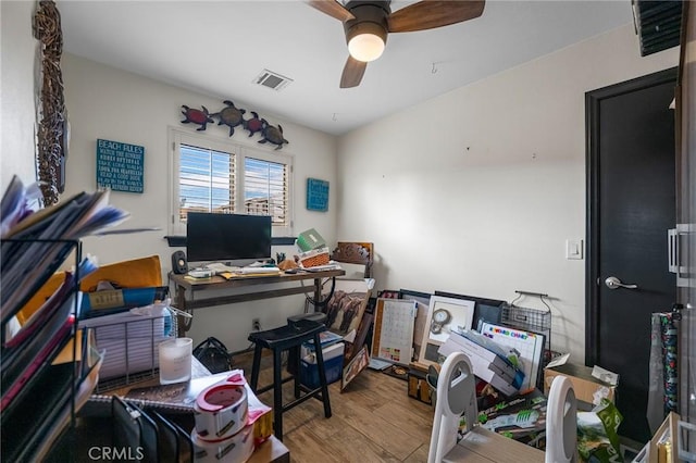 office area with ceiling fan and hardwood / wood-style floors