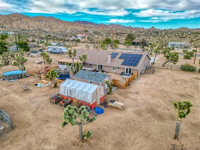 birds eye view of property featuring a mountain view