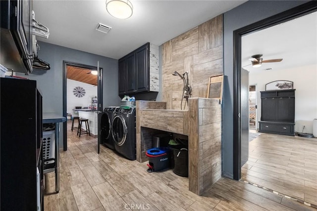 laundry room with independent washer and dryer and ceiling fan