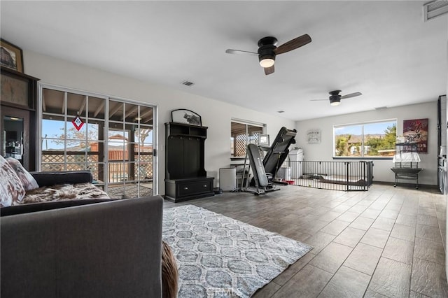 interior space with ceiling fan