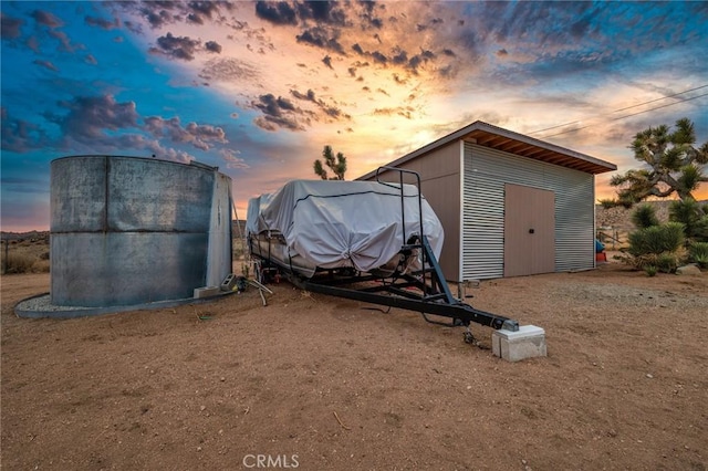 view of outdoor structure at dusk