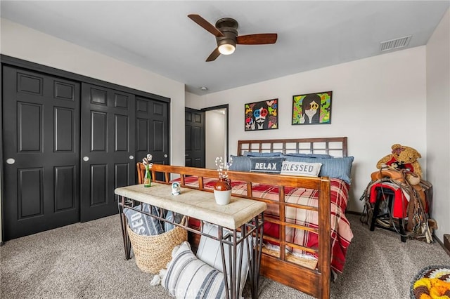 bedroom featuring ceiling fan, carpet, and a closet