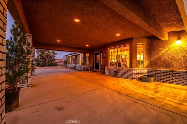 view of patio terrace at dusk