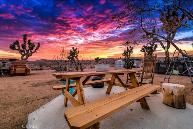 view of patio terrace at dusk