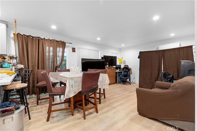 dining room with light hardwood / wood-style flooring