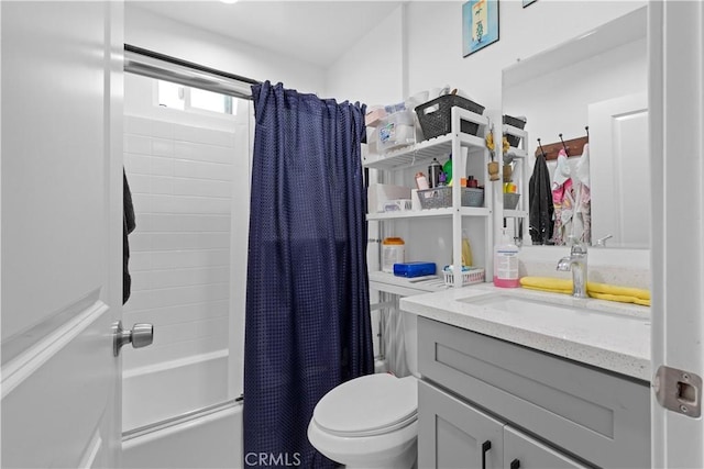 full bathroom with vanity, toilet, and shower / tub combo with curtain