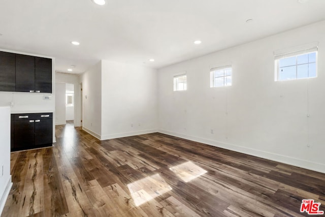 unfurnished living room with wood-type flooring