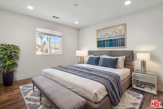 bedroom featuring dark hardwood / wood-style flooring