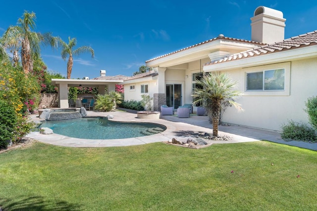 back of property featuring a patio and a yard