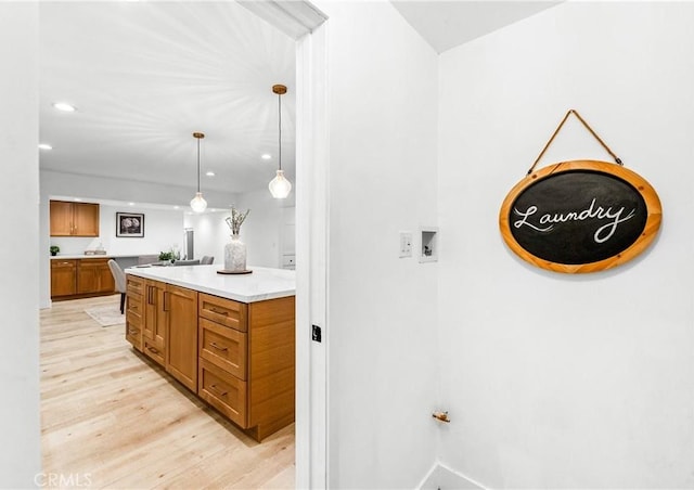 bathroom featuring vanity, recessed lighting, and wood finished floors