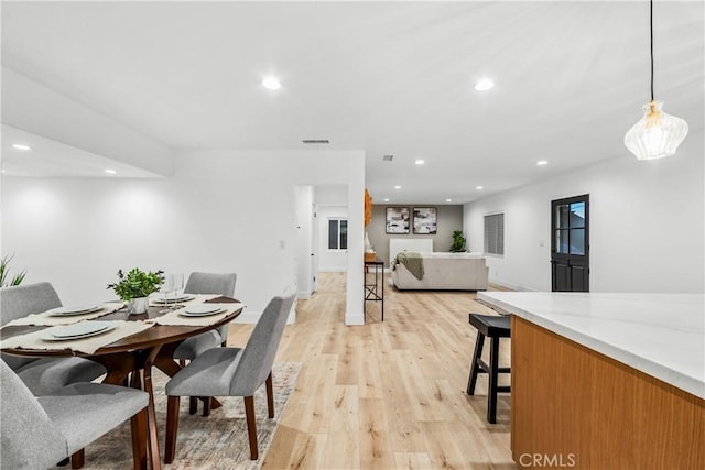 dining area with visible vents, recessed lighting, and light wood-style floors