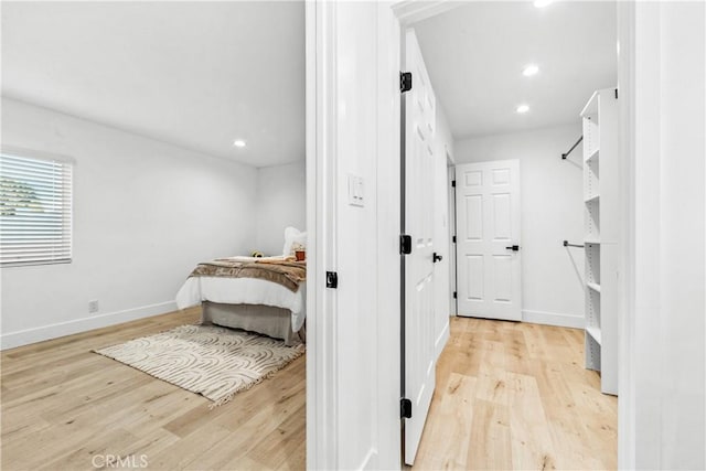 bedroom with light hardwood / wood-style flooring