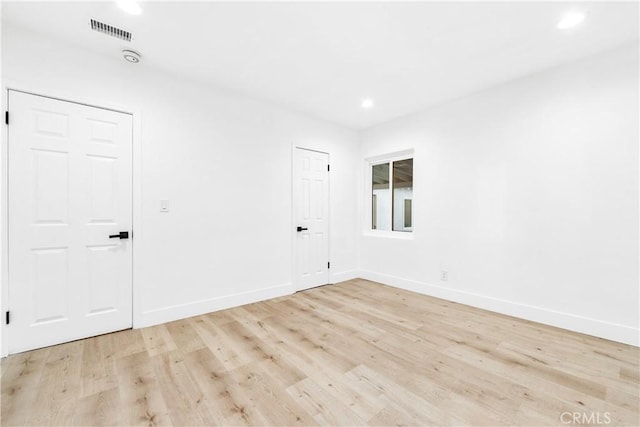 unfurnished room featuring light hardwood / wood-style flooring