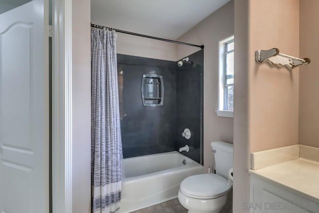 full bathroom with tile patterned floors, toilet, vanity, and shower / tub combo with curtain