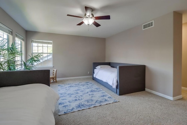 carpeted bedroom with ceiling fan