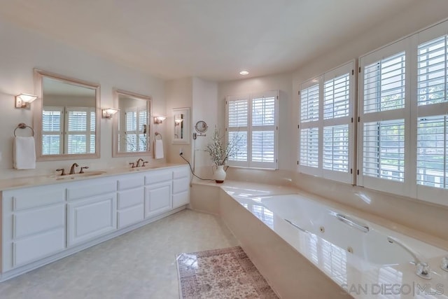 bathroom featuring a tub and vanity