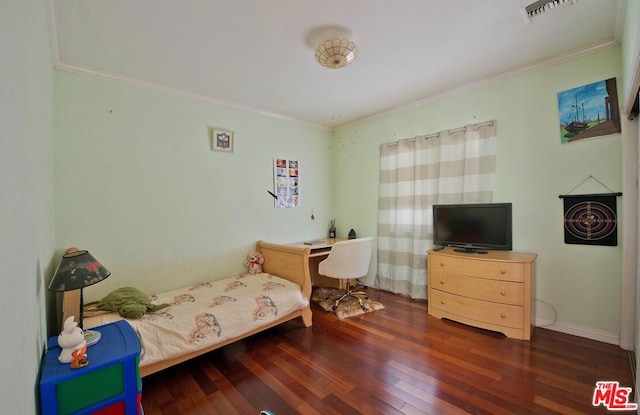 bedroom featuring ornamental molding and dark hardwood / wood-style flooring