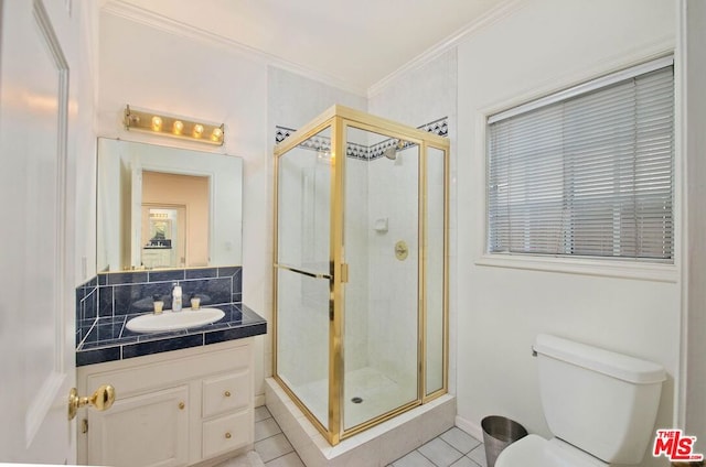 bathroom with tile patterned floors, an enclosed shower, vanity, and toilet