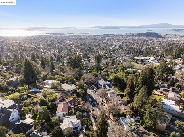 bird's eye view with a water and mountain view