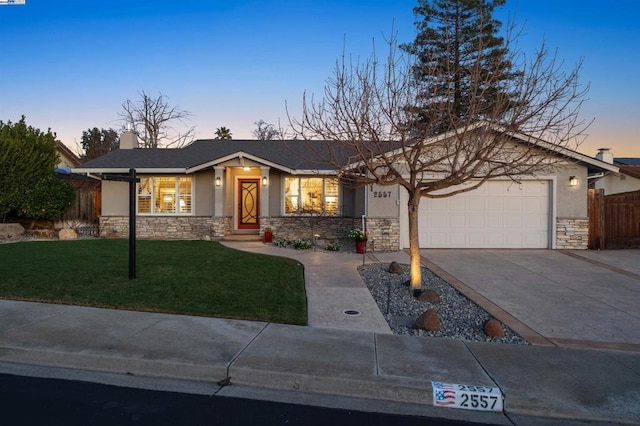 view of front of house with a lawn and a garage