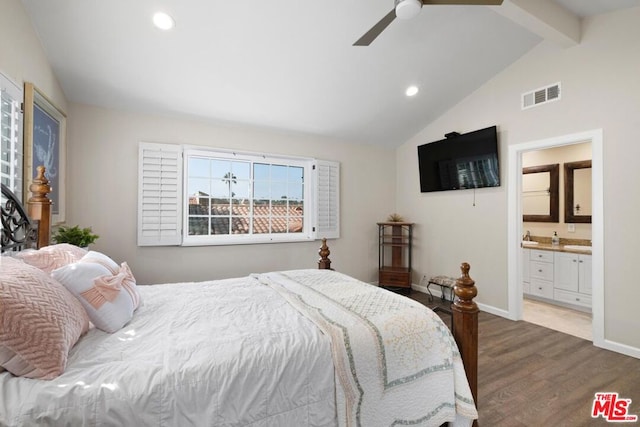 bedroom featuring ensuite bathroom, dark wood-type flooring, vaulted ceiling with beams, and ceiling fan