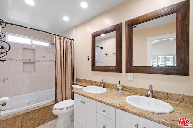 full bathroom featuring vanity, toilet, and shower / bath combo