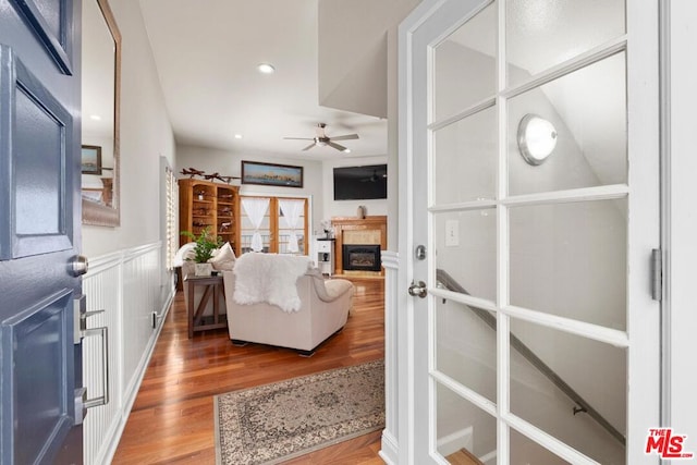 living room with ceiling fan and hardwood / wood-style floors