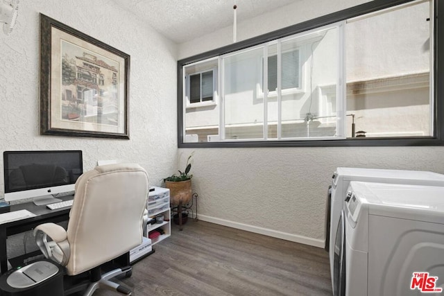 office space featuring wood-type flooring, separate washer and dryer, and a textured ceiling