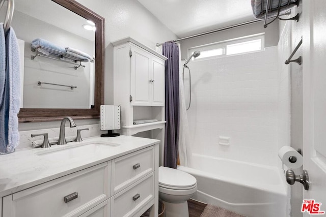 full bathroom featuring vanity, toilet, and shower / bath combo with shower curtain