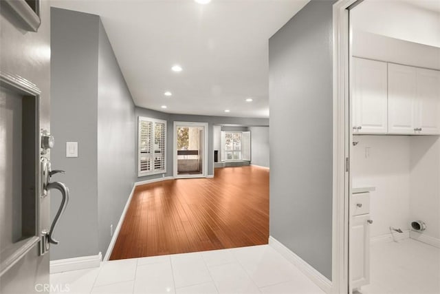 hallway featuring light tile patterned floors