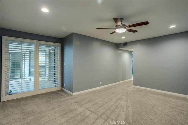 carpeted empty room with ceiling fan