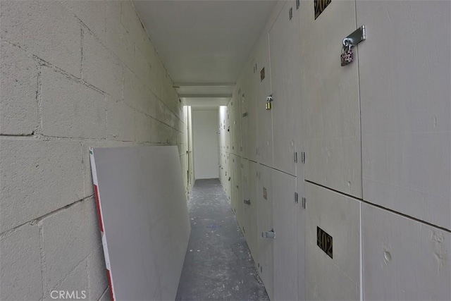 corridor with concrete flooring