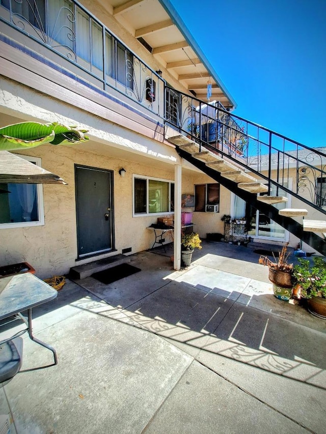 doorway to property featuring a patio area