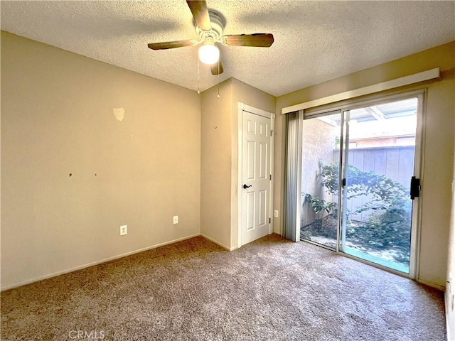 interior space featuring ceiling fan, access to exterior, carpet floors, and a textured ceiling