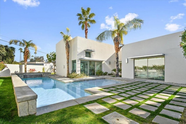 back of house with a patio area and a fenced in pool